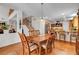 The dining area flows into the kitchen and features wood floors and light at 2727 Warm Rays Ave, Henderson, NV 89052