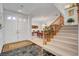 Inviting foyer with double doors, staircase, and tile flooring, offering a glimpse into the home's interior at 2727 Warm Rays Ave, Henderson, NV 89052