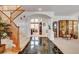 Elegant foyer with dark tile accents and a grand staircase, creating a striking first impression at 2727 Warm Rays Ave, Henderson, NV 89052
