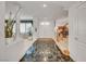 Spacious foyer with dark marble flooring, leading to an open living area and a staircase to the upper level at 2727 Warm Rays Ave, Henderson, NV 89052