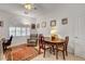 Bright home office with white walls, plush chair, wood table and a large window at 2727 Warm Rays Ave, Henderson, NV 89052