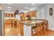 Bright kitchen featuring a spacious island with seating, ample counter space, and stainless steel appliances at 2727 Warm Rays Ave, Henderson, NV 89052