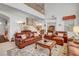 Open living room features comfortable seating, wood accents, and plenty of natural light at 2727 Warm Rays Ave, Henderson, NV 89052