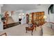 Inviting living room with dark accents that flows seamlessly into the adjacent dining and entry areas at 2727 Warm Rays Ave, Henderson, NV 89052