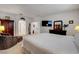 Spacious main bedroom features neutral tones, with a bed and seating area at 2727 Warm Rays Ave, Henderson, NV 89052