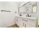 Stylish bathroom features a double vanity, black fixtures, and a modern design at 2958 Al De La St, Las Vegas, NV 89146