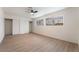 Bright bedroom features modern ceiling fan, wood-look floors, and dual closets at 2958 Al De La St, Las Vegas, NV 89146