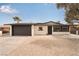 Front exterior featuring a well-maintained, single-story home with a driveway and desert-style landscaping at 2958 Al De La St, Las Vegas, NV 89146