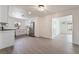 Renovated kitchen featuring white cabinets, modern appliances, and a seamless flow to the living spaces at 2958 Al De La St, Las Vegas, NV 89146