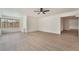 Bright living room with modern flooring and a ceiling fan at 2958 Al De La St, Las Vegas, NV 89146