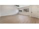 Spacious living room with laminate flooring, ample natural light, and neutral paint palette at 2958 Al De La St, Las Vegas, NV 89146