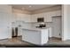 Modern kitchen featuring white cabinets, stainless steel appliances, and a large center island at 3044 Dagny St # Lot 7, Las Vegas, NV 89121