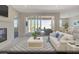 Bright living room with a fireplace and sliding glass doors that open to a beautiful outdoor patio at 3044 Dagny St # Lot 7, Las Vegas, NV 89121