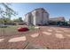 Large backyard area with synthetic grass, desert landscaping, lounge seating, and plenty of room to entertain at 3169 Crystal Moon Rd, Henderson, NV 89052
