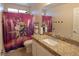 Bathroom features a stylish vanity with granite countertops, a modern sink, and unique shower curtain at 3169 Crystal Moon Rd, Henderson, NV 89052