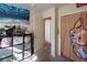 Neutral bedroom featuring a dark shelf unit with plenty of storage space and natural light at 3169 Crystal Moon Rd, Henderson, NV 89052