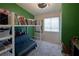 Cozy bedroom featuring a loft bed with built-in storage shelves and a gray futon sofa at 3169 Crystal Moon Rd, Henderson, NV 89052