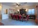 Spacious dining room with a large wooden table, seating for eight, and a vintage world map at 3169 Crystal Moon Rd, Henderson, NV 89052