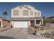 Charming two-story home featuring a three-car garage, drought-resistant landscaping, and a welcoming front porch at 3169 Crystal Moon Rd, Henderson, NV 89052