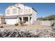 Inviting two-story home features a three-car garage, low-maintenance landscaping, and a cozy front porch at 3169 Crystal Moon Rd, Henderson, NV 89052