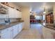 Bright kitchen featuring granite countertops, white cabinets, and stainless steel knife set at 3169 Crystal Moon Rd, Henderson, NV 89052