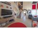 Open-concept living room with high ceilings, staircase, and a view into the kitchen at 3169 Crystal Moon Rd, Henderson, NV 89052