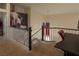 Spacious loft featuring black iron railings and a black desk; bright and airy, carpeted at 3169 Crystal Moon Rd, Henderson, NV 89052