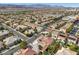 High-angle shot exhibiting a neighborhood with lush greenery, varied house designs, and orderly roadways at 319 Fox Lake Ave, Las Vegas, NV 89148