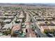 Birds-eye view of a residential community showcasing tiled rooftops, swimming pools, and organized street layouts at 319 Fox Lake Ave, Las Vegas, NV 89148
