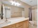 Bathroom showcasing a vanity with a sink, large mirror, and a combination shower and tub at 319 Fox Lake Ave, Las Vegas, NV 89148