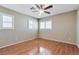 This bedroom features hardwood floors, a ceiling fan and bright, natural light at 319 Fox Lake Ave, Las Vegas, NV 89148