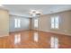 Primary bedroom has wood flooring and two bright, shuttered windows at 319 Fox Lake Ave, Las Vegas, NV 89148