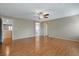 Large bedroom has wood flooring and multiple entryways to other areas of the home at 319 Fox Lake Ave, Las Vegas, NV 89148