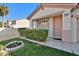 Charming home exterior with a well-manicured lawn and vibrant flower bed at 319 Fox Lake Ave, Las Vegas, NV 89148