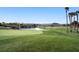 Scenic golf course view with lush greenery and a tranquil pond at 319 Fox Lake Ave, Las Vegas, NV 89148