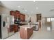 Spacious kitchen featuring modern stainless steel appliances, an island, and a stylish backsplash at 319 Fox Lake Ave, Las Vegas, NV 89148
