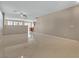 Large living space featuring tile flooring, neutral paint and trim, and lots of bright, natural light at 319 Fox Lake Ave, Las Vegas, NV 89148
