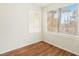 Well-lit room featuring laminated floors and two windows that provide ample natural light at 3225 Casey Dr # 203, Las Vegas, NV 89120