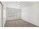 Clean bedroom with plush carpeting, neutral walls, and a large window at 3225 Casey Dr # 203, Las Vegas, NV 89120
