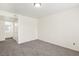 Carpeted bedroom leading to the ensuite bathroom, with neutral paint at 3225 Casey Dr # 203, Las Vegas, NV 89120