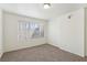 Clean carpeted bedroom with a sunny window and neutral paint at 3225 Casey Dr # 203, Las Vegas, NV 89120
