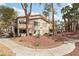 Beautiful condo with lush landscaping and mature trees, showcasing an inviting curb appeal and serene setting at 3225 Casey Dr # 203, Las Vegas, NV 89120