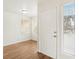 Bright entryway featuring wood-look flooring, a white door, and windows at 3225 Casey Dr # 203, Las Vegas, NV 89120