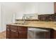 This kitchen features a stainless steel dishwasher and granite countertop at 3225 Casey Dr # 203, Las Vegas, NV 89120
