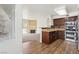 Modern kitchen with stainless steel appliances, granite countertops, and seamless flow into the living area at 3225 Casey Dr # 203, Las Vegas, NV 89120