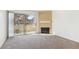 Cozy living room with a fireplace and sliding glass door to the outdoor patio at 3225 Casey Dr # 203, Las Vegas, NV 89120