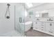 Modern bathroom featuring a soaking tub, glass shower, and double vanity at 3329 Buffalo Narrows Cir, Las Vegas, NV 89129