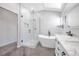 Modern bathroom featuring a soaking tub, glass shower, and double vanity at 3329 Buffalo Narrows Cir, Las Vegas, NV 89129