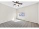 Carpeted bedroom features a large window providing natural light at 3329 Buffalo Narrows Cir, Las Vegas, NV 89129