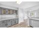 Modern kitchen with shaker cabinets, granite countertops and hardwood floors at 3329 Buffalo Narrows Cir, Las Vegas, NV 89129